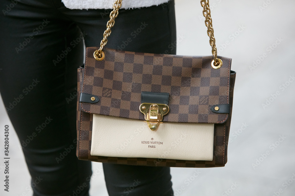 Louis Vuitton checkered bag with golden chain on September 19
