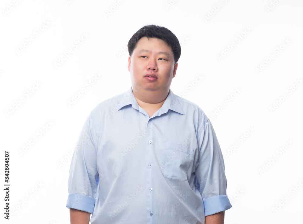 Asian fat man in blue shirt thinking and looking to copyspace isolated on white background. Asian fat man in blue shirt thinking and looking to copyspace isolated on white background.