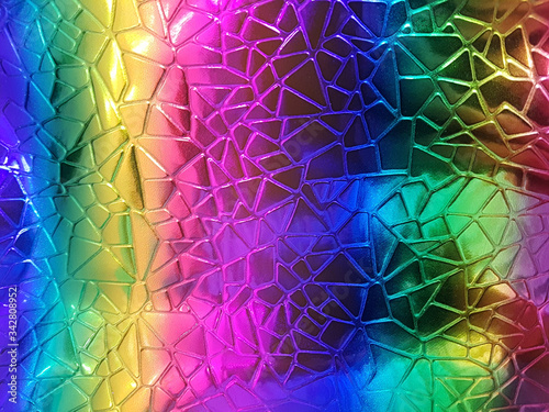 Obraz na plátně A shiny neon colored surface with many small triangular shaped cells