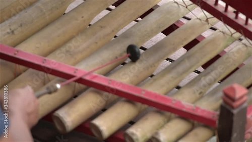 Musicians play in traditional Balinese musical instrument Gambang. Close up. photo