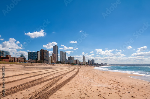 South beach and cityscape of Durban, South Africa. Durban is famous as a major centre of tourism because of the city's warm subtropical climate and extensive beaches