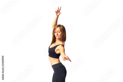Young woman in sports movement on a white background.