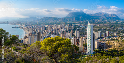 Panoramic view of the city of Benidorm and the mountains in the background. Multi-storey buildings