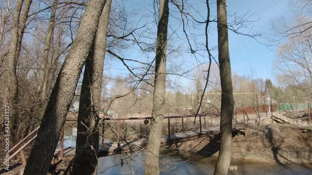Wooden bridge with metal railing Wooden bridge with metal railing