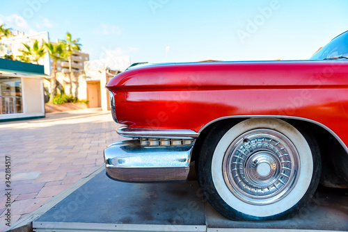 front side of a red retro car © bodiaphoto