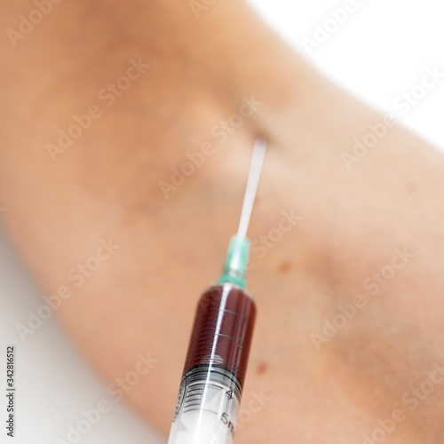 syringe in the arm