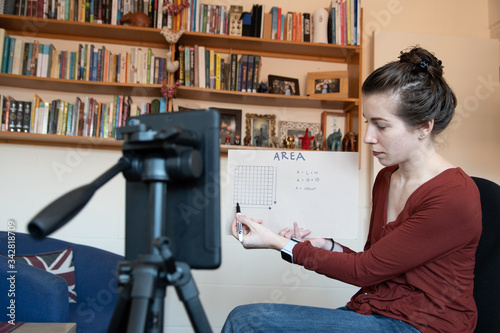 School teachers are forced to teach their lessons from home using their phones to video themselves