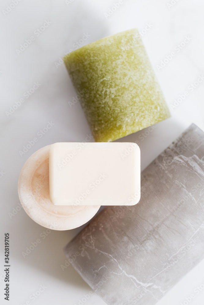 Soap for hands with mock up space at light background with candles Soap for hands with mock up space at light background with candles