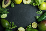 green vegetables and fruits on black background