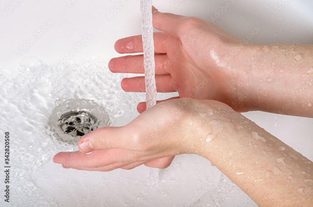 Fototapeta premium Wash hands with soap and tap water in bathroom as protection against bacteria, flu and dirt for skin health