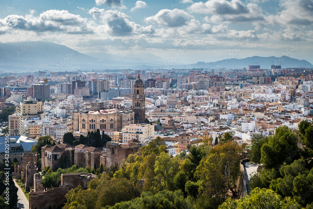 Cityscape of Malaga on a cloudy Winter day, with the cathedral and some of the main monuments to be recognised.