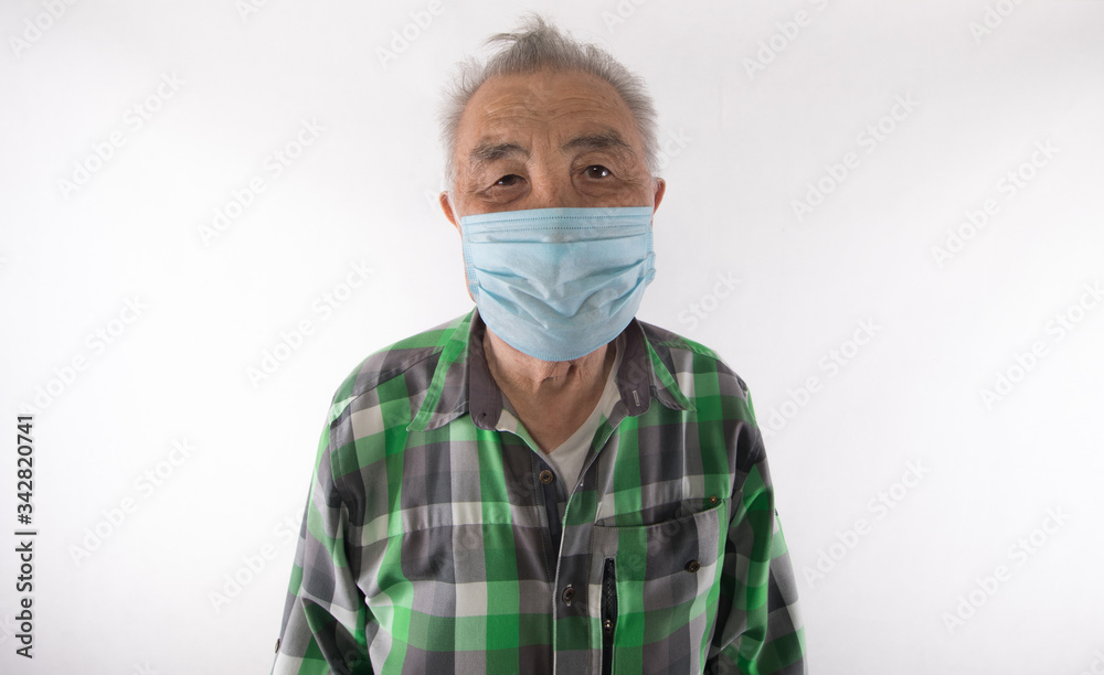 portrait of an old man in a medical mask on a white background portrait of an old man in a medical mask on a white background