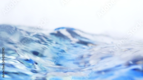 Soft blur focus of Abstract water splash surface filling the frame with the water drop and waving liquid with an air bubble on a white background and copy space.