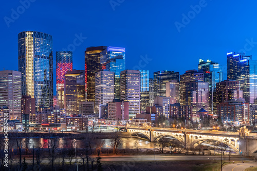 View of Calgary's beautiful skyline at night along the Bow River. 
