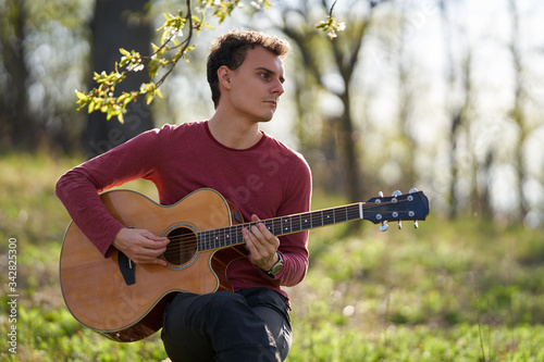 Young guitarist outdoor