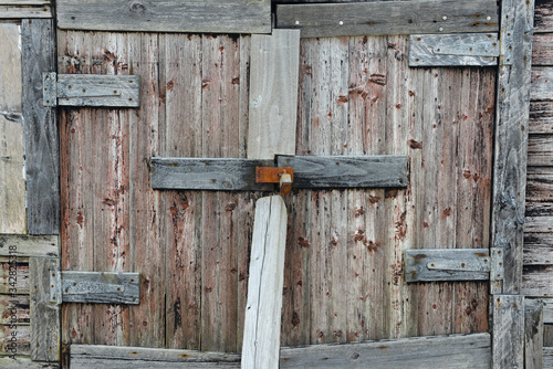Locked old beach hut door, Chesil Beach UK