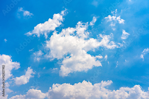 White clouds and sunlights on blue sky background 