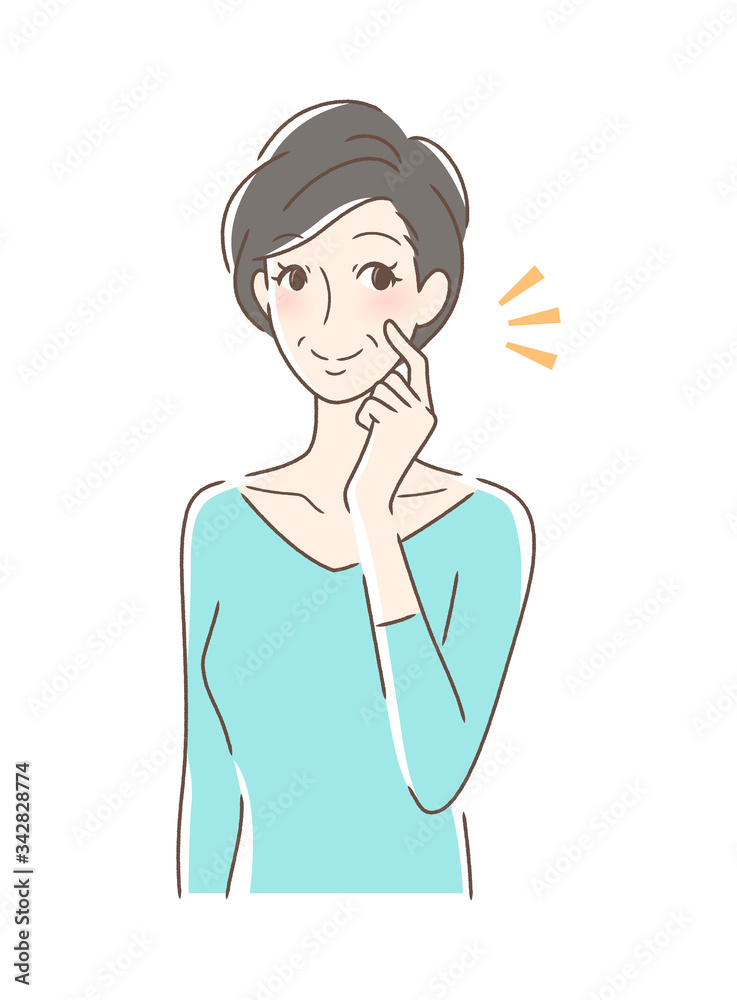 頬をつんつんして笑顔の女性 頬をつんつんして笑顔の女性