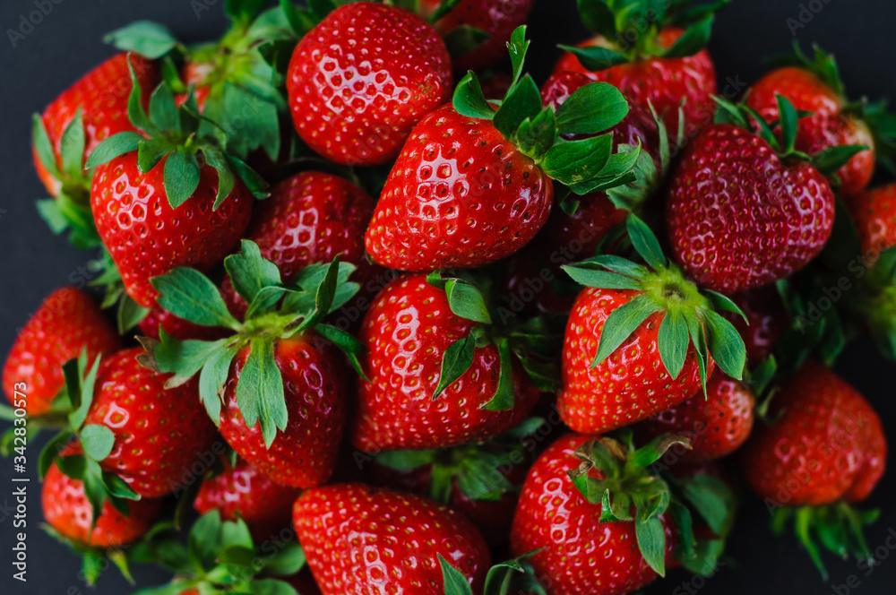 Vegetables and fruits in one color, background from freshly harvested strawberries, Fresh strawberry background,