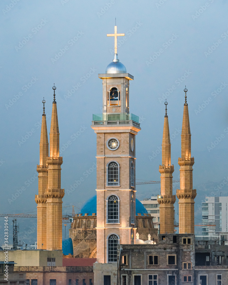 Fototapeta premium Saint George Maronite Cathedral's new bell tower in front of al-Amin mosque in downtown Beirut, Lebanon