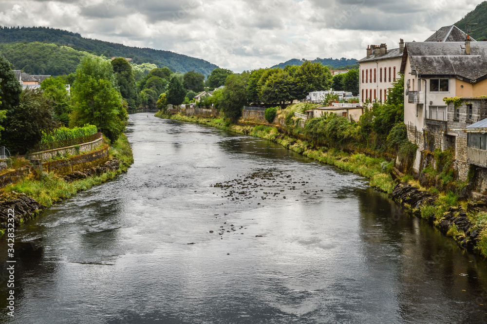 View of the river Dordogne at Bort les Orgues, a little french village in Correze, Auvergne. The beauty of the river in a very cloudy day.