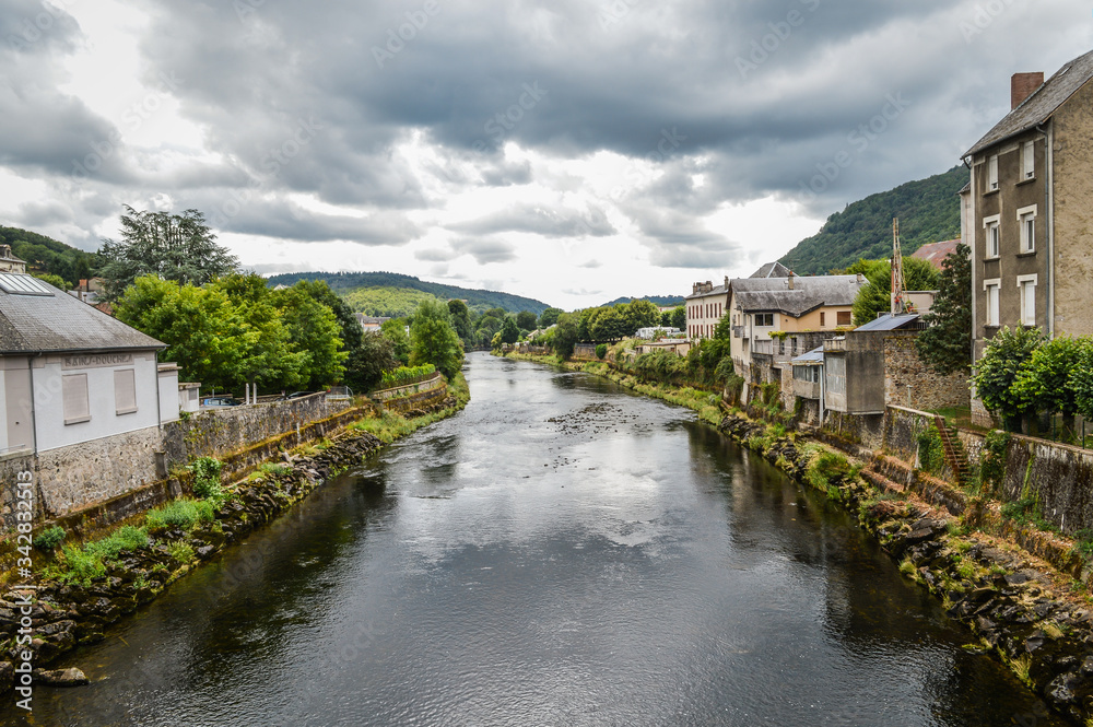 View of the river Dordogne at Bort les Orgues, a little french village in Correze, Auvergne. The beauty of the river in a very cloudy day.