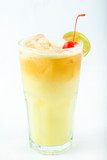 yellow drink with ice in a tall glass