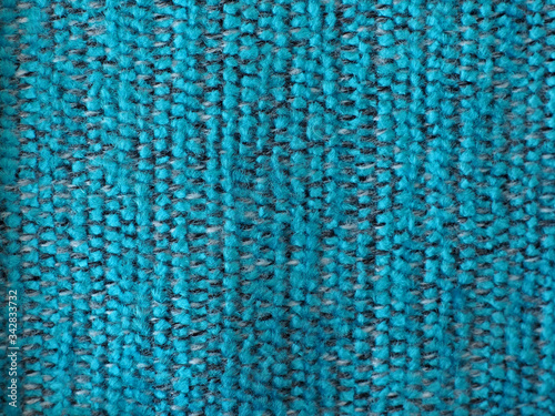 blue-sea, black, gray woven, hairy fabric with a striped pattern and visible texture. background or texture, closeup.