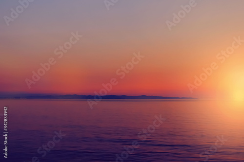 Beautiful defocused blurred sunset or sunrise sea view as background for your creative design. Local tourism concept