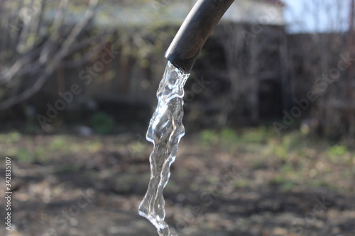 water flowing from a faucet © Эльдар Гибадуллин