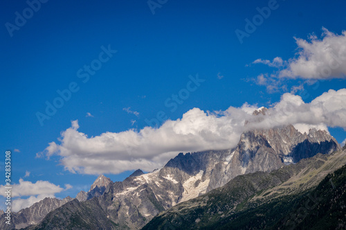 French Alps mountains in a cloudy summer day, seen from Les Houches near Chamonix, Haute Savoy, France. © sebastianosecondi