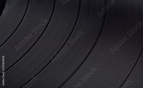 Black Vinyl Disc Record with recorded music, background or texture, closeup