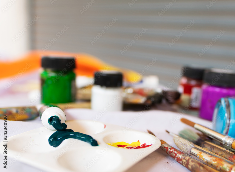 Visual art equipment is on the table covered with white cloth, Art Education, Learning to the 21st century, Stem studies.Selectively focus on specific points and blur in the image. Visual art equipment is on the table covered with white cloth, Art Education, Learning to the 21st century, Stem studies.Selectively focus on specific points and blur in the image.