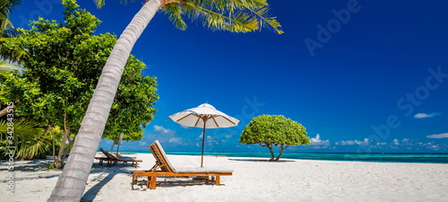 Beautiful beach. Chairs on the sandy beach near the sea. Summer holiday and vacation concept for tourism. Inspirational tropical landscape  © icemanphotos