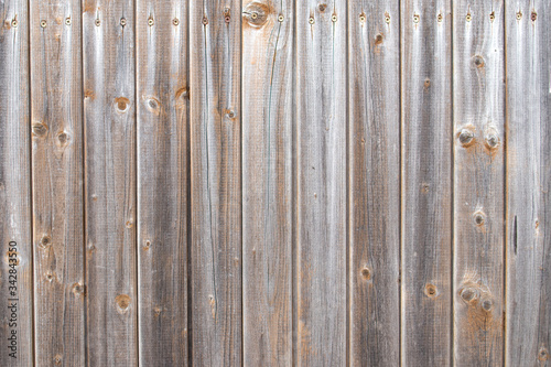 Background backsplash countrystyle wooden fence made from panels in rustic ecological style
