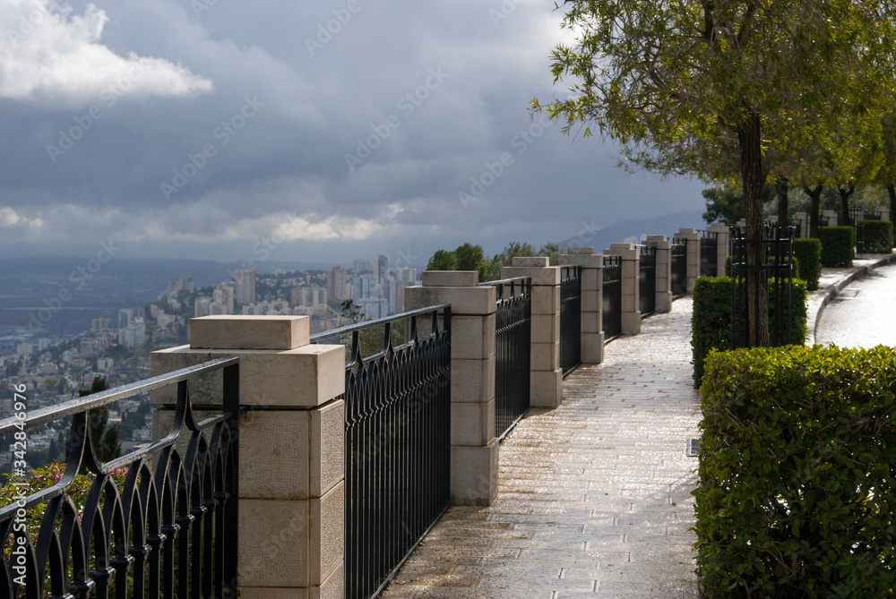 Promenade in Haifa, Israel. A view of the city from above on a cloudy day.