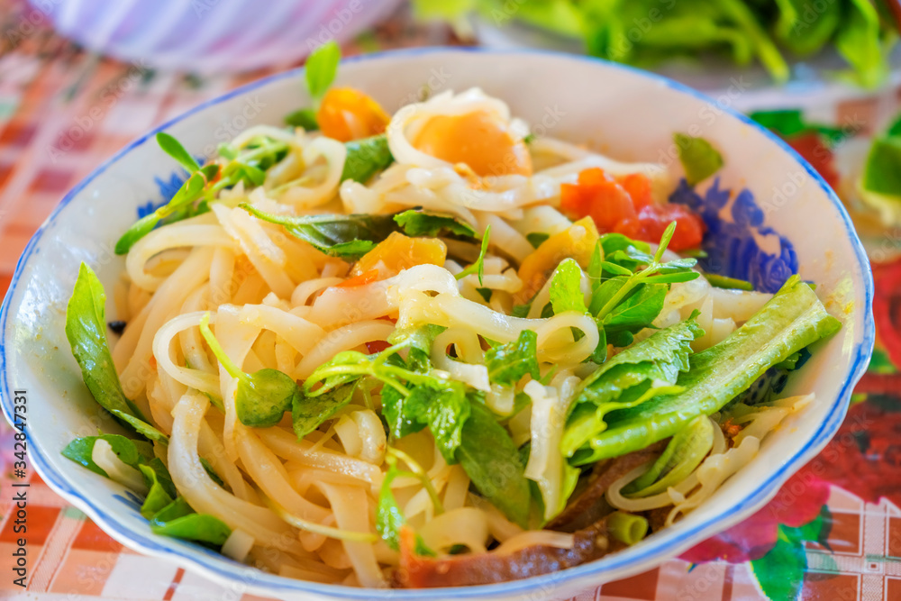 Vietnamese noodle Mi Quang at Tra Que vegetable village, Hoi An old town, Vietnam