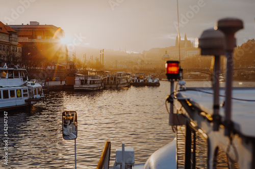 Sunset view on Prague old town, Vlatava river and iconic Charles bridge in cozy fog, Czech Republic photo