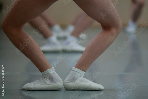Beautiful legs in plie at ballet dancers