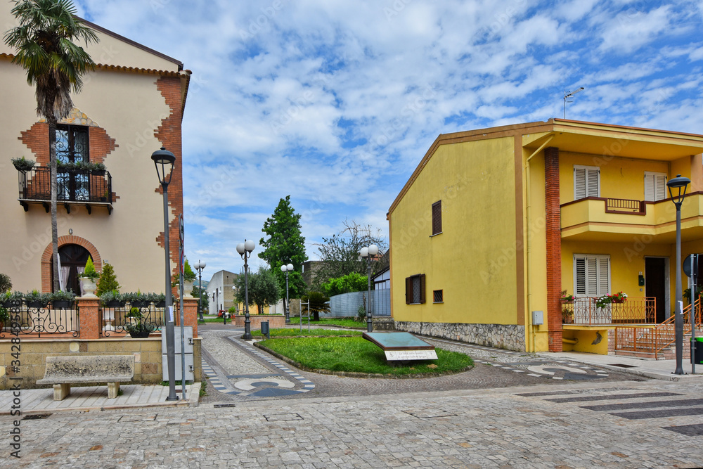 A narrow street between the old houses of a village in the province of Benevento, Italy