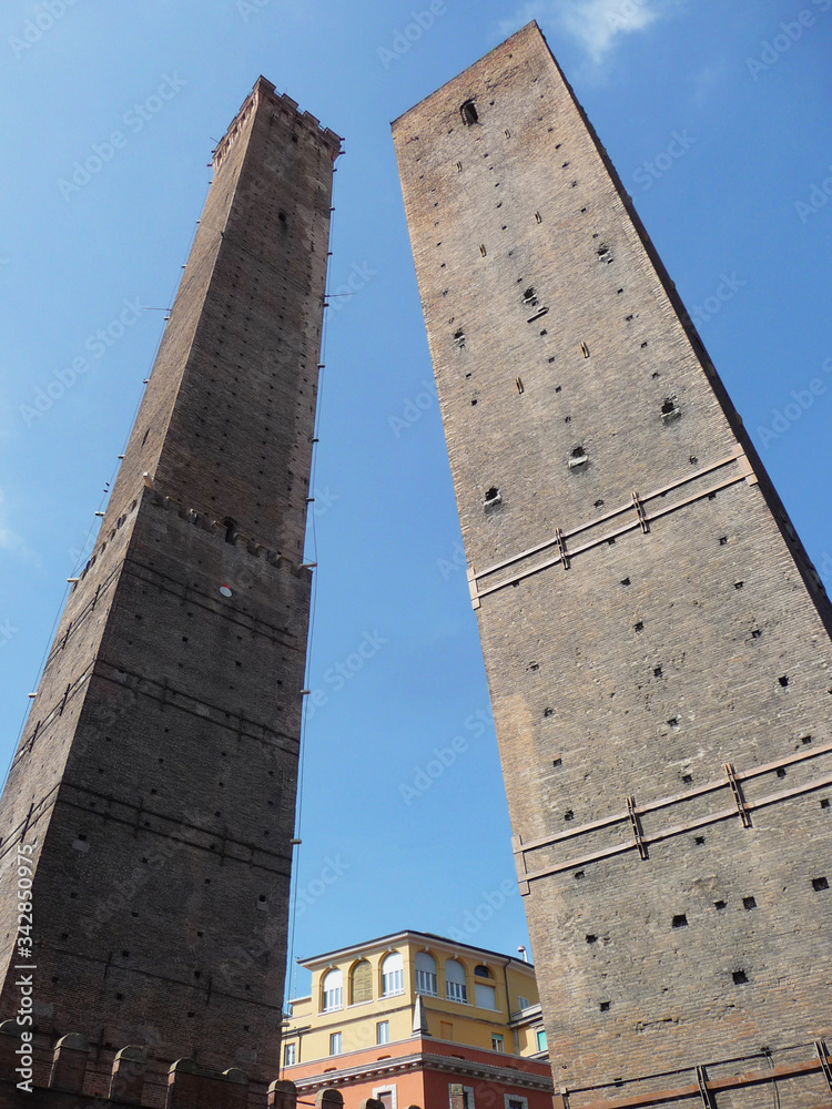 Leaning brick towers of Asinelli and Garisenda. City of Bologna. Italy.