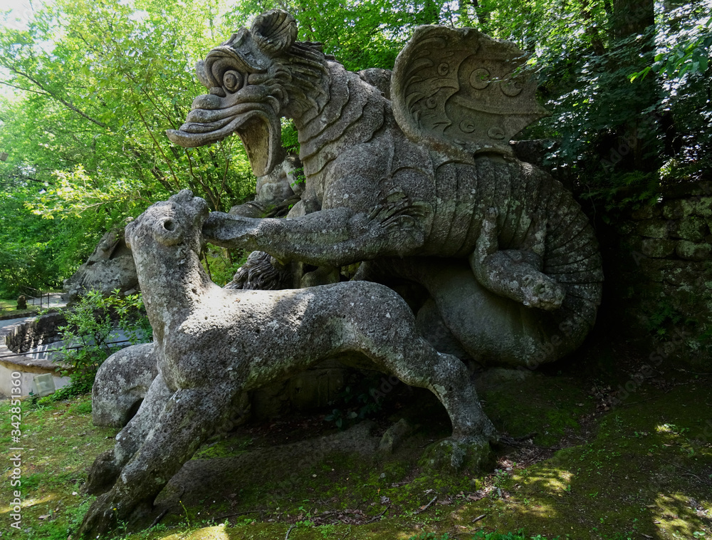 Colossal Mannerist Renaisance statue of dragon hunting a wolf. 16th Century. Bomarzo. Italy.