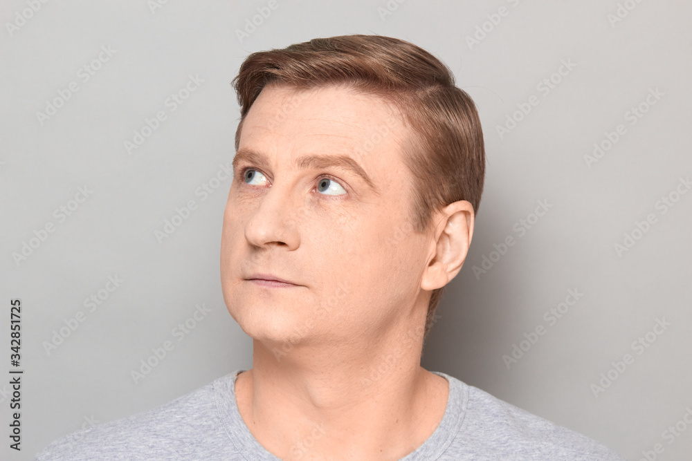 Portrait of blond mature man with neutral calm expression on face Portrait of blond mature man with neutral calm expression on face