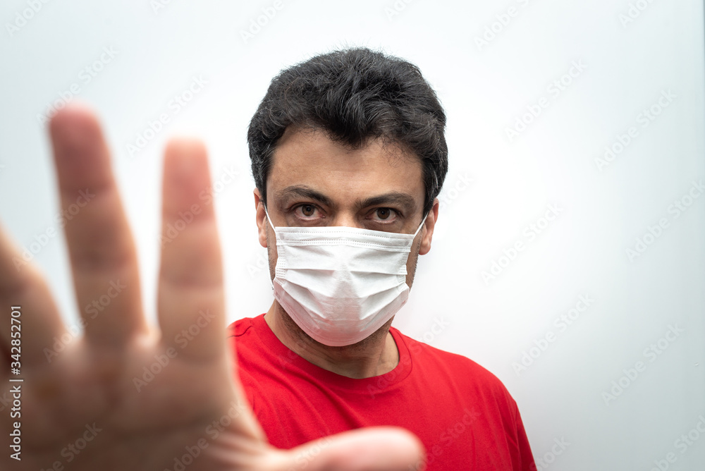 Man dressing a mask for diseases protection. Man dressing a mask for diseases protection.