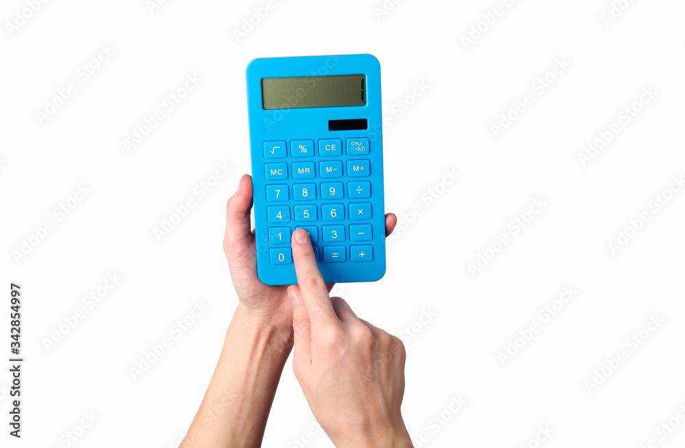 Hand holds blue calculator Isolated on a white background. - obrazy, fototapety, plakaty 