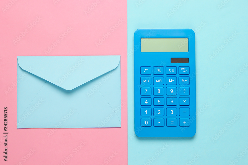 Calculator with envelope on pink blue pastel background. Top view Calculator with envelope on pink blue pastel background. Top view