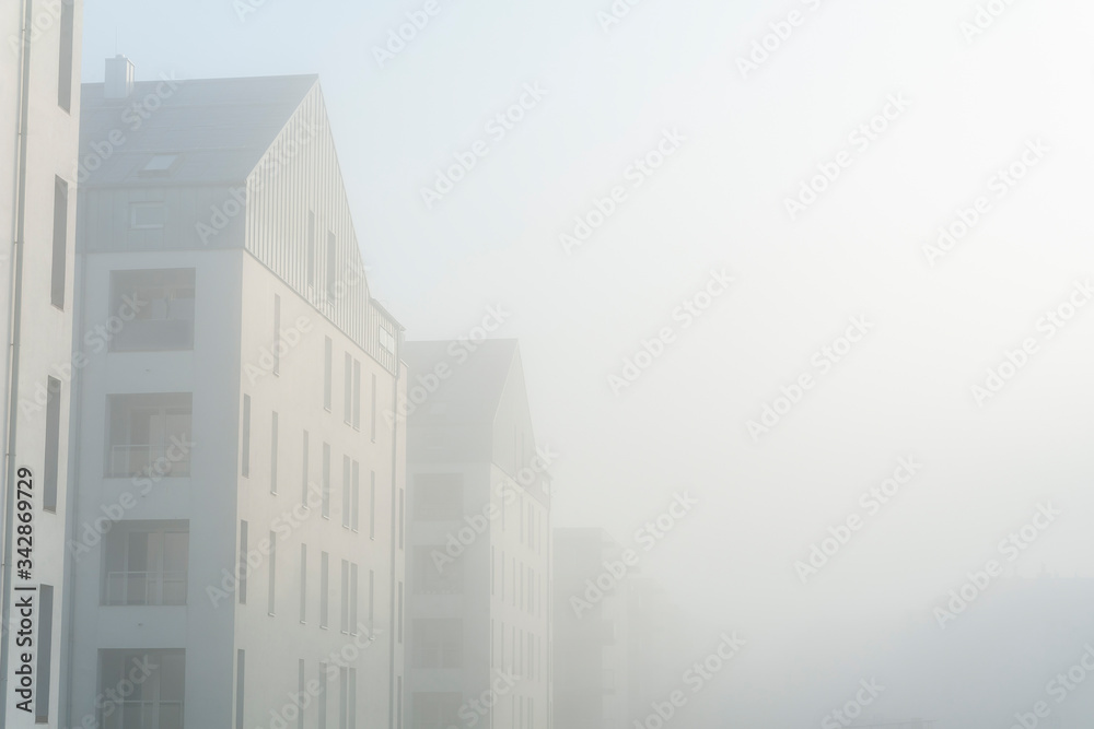 Modern apartment buildings in a foggy morning Modern apartment buildings in a foggy morning