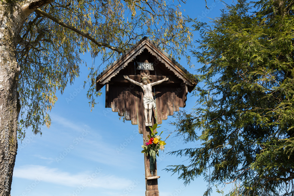 Jesus on the cross besides a footpath in Bavarian