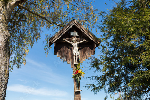 Jesus on the cross besides a footpath in Bavarian photo