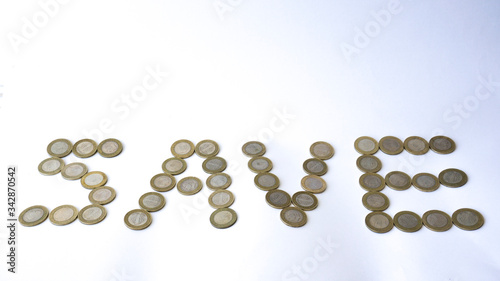 Fotografie Saving and growth concept with metal coins isolated on white background